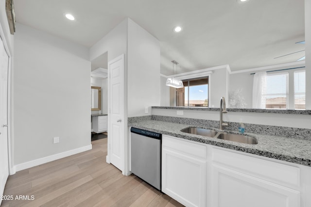 20100 N 78th Pl Unit 3103, Scottsdale, AZ 85255 - kitchen with stainless steel dishwasher, a sink, light wood finished floors, white cabinets, and light stone countertops