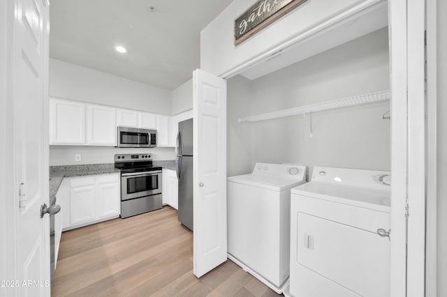 20100 N 78th Pl Unit 3103, Scottsdale, AZ 85255 - laundry room featuring separate washer and dryer, light wood finished floors, and recessed lighting