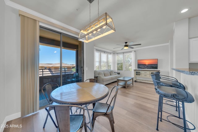 20100 N 78th Pl Unit 3103, Scottsdale, AZ 85255 - dining space featuring light wood-style flooring, ceiling fan, ornamental molding, and baseboards