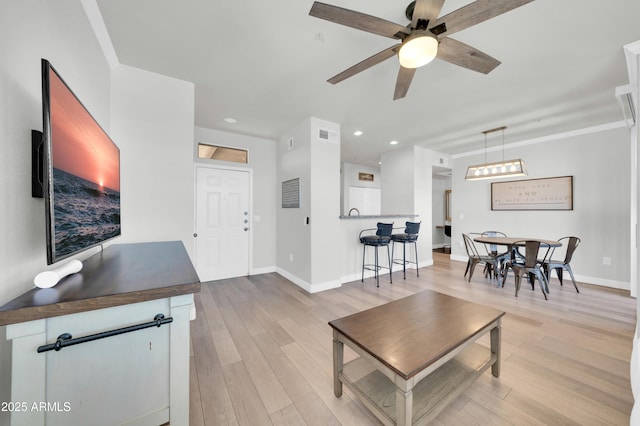 20100 N 78th Pl Unit 3103, Scottsdale, AZ 85255 - living area featuring light wood-style floors, baseboards, a ceiling fan, recessed lighting, and ornamental molding