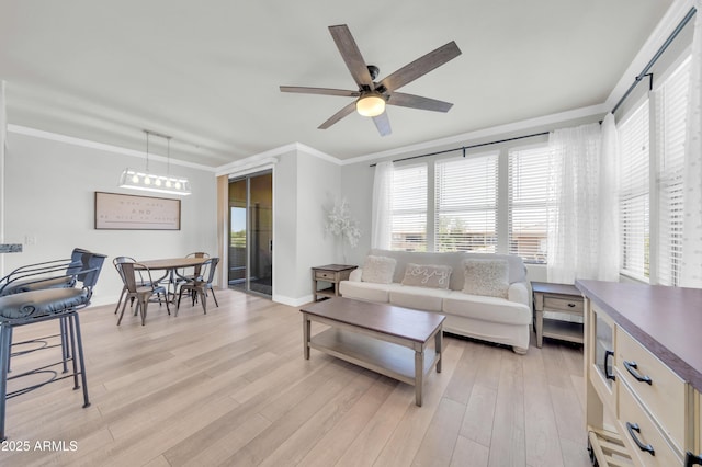 20100 N 78th Pl Unit 3103, Scottsdale, AZ 85255 - living area with ornamental molding, ceiling fan, light wood finished floors, and healthy amount of natural light