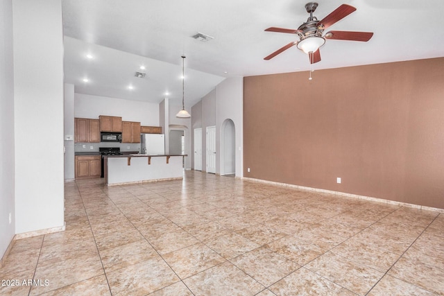 unfurnished living room with arched walkways, high vaulted ceiling, visible vents, baseboards, and a ceiling fan