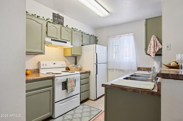 kitchen featuring white appliances, under cabinet range hood, green cabinets, a sink, and light tile patterned flooring