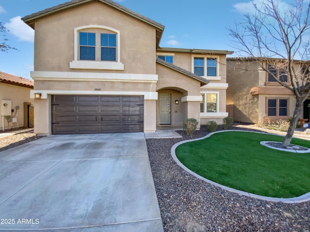 view of front of house with a garage and a front lawn