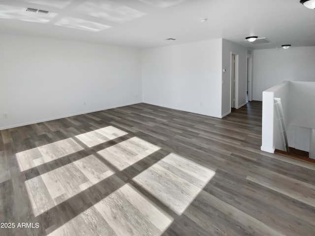 spare room with dark hardwood / wood-style floors