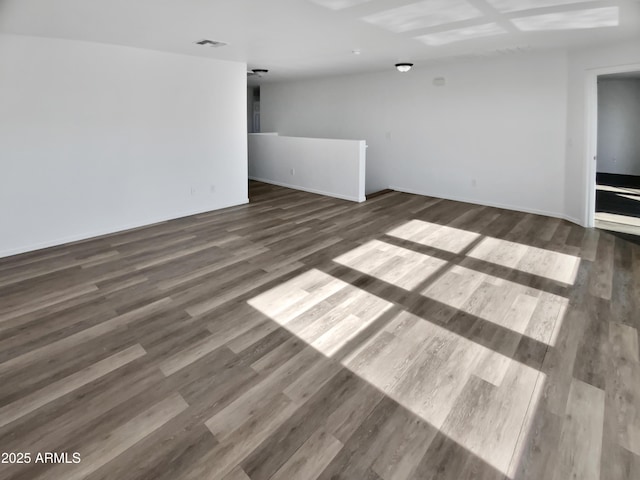 unfurnished room with dark wood-type flooring