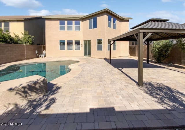 view of pool featuring a patio area and a gazebo