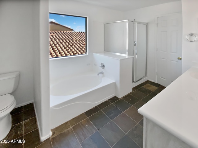 full bathroom featuring toilet, vanity, and separate shower and tub