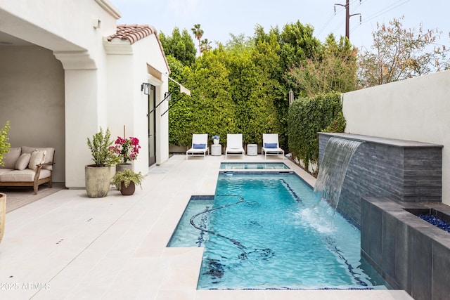 view of swimming pool featuring a patio area