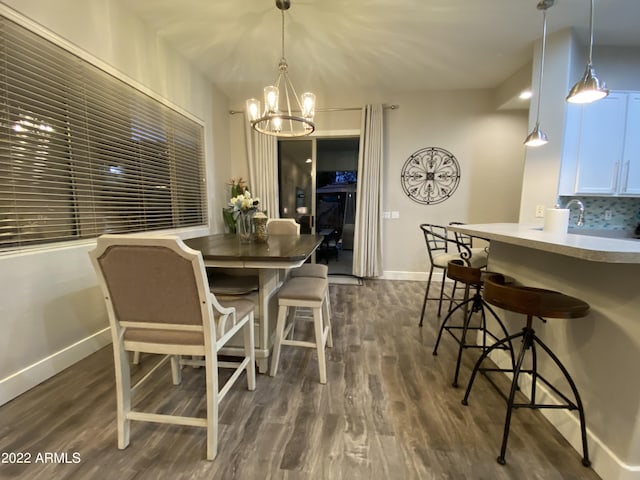 2042 W Periwinkle Way, Chandler, AZ 85248 - dining room featuring a chandelier, baseboards, and dark wood finished floors