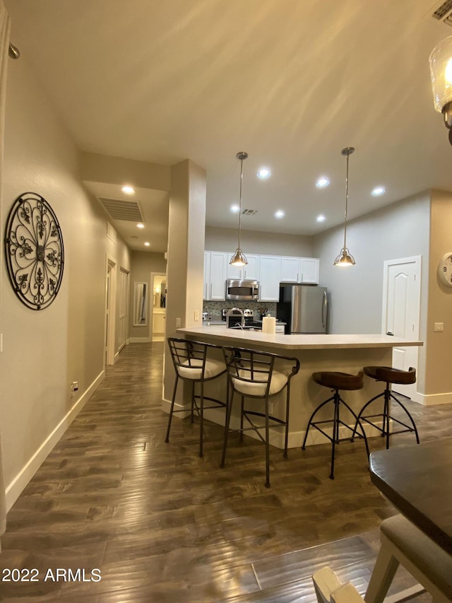 2042 W Periwinkle Way, Chandler, AZ 85248 - dining space with baseboards, dark wood-type flooring, and recessed lighting