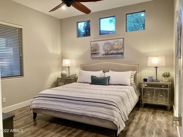 2042 W Periwinkle Way, Chandler, AZ 85248 - bedroom with baseboards, wood finished floors, and a ceiling fan