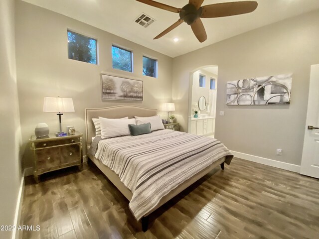 2042 W Periwinkle Way, Chandler, AZ 85248 - bedroom with arched walkways, wood finished floors, recessed lighting, baseboards, and a ceiling fan