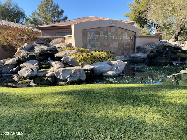 2042 W Periwinkle Way, Chandler, AZ 85248 - community sign featuring a yard and a garden pond