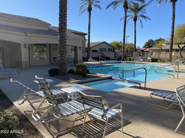 2042 W Periwinkle Way, Chandler, AZ 85248 - community pool with a patio, a hot tub, and fence
