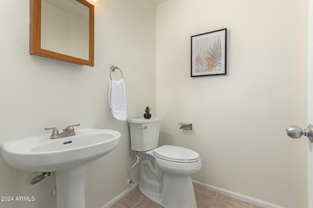 bathroom featuring tile patterned flooring and toilet