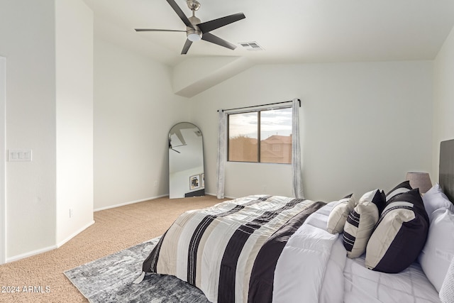 carpeted bedroom featuring ceiling fan and vaulted ceiling