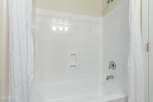 bathroom featuring shower / tub combo with curtain