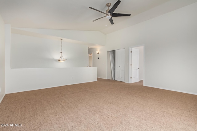 unfurnished room with lofted ceiling, carpet, and ceiling fan