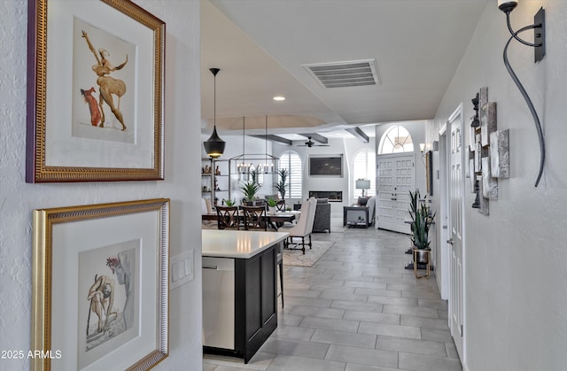 kitchen featuring a fireplace, recessed lighting, light countertops, visible vents, and dishwasher