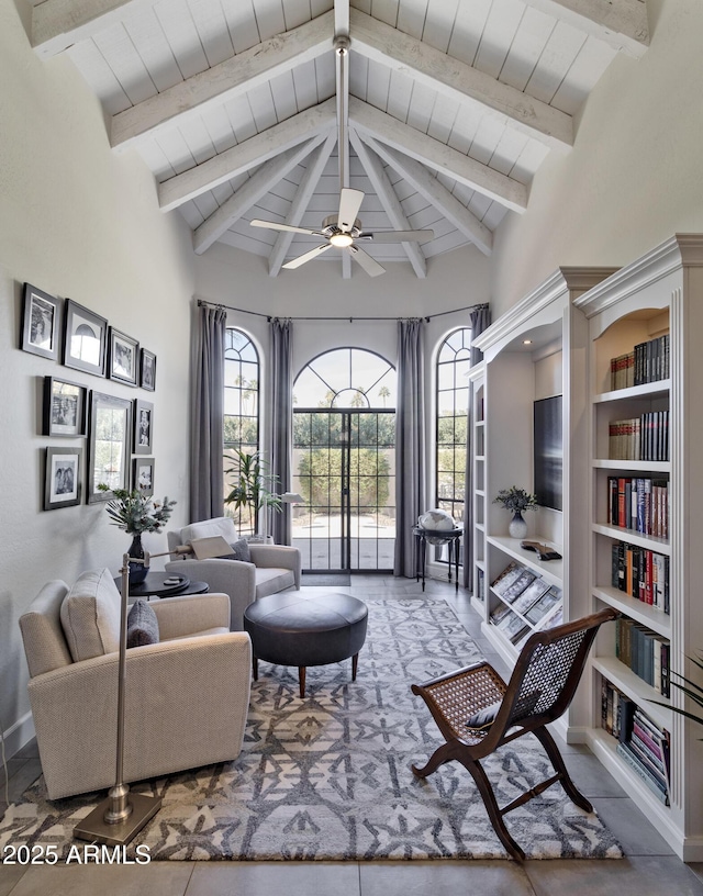 sitting room featuring vaulted ceiling with beams, a healthy amount of sunlight, and wooden ceiling