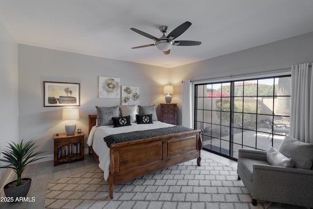 bedroom with ceiling fan, baseboards, and light tile patterned floors