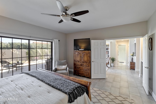 bedroom featuring lofted ceiling, light tile patterned floors, baseboards, and a ceiling fan