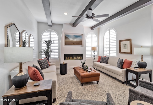 living area with baseboards, ceiling fan, beamed ceiling, a fireplace, and recessed lighting