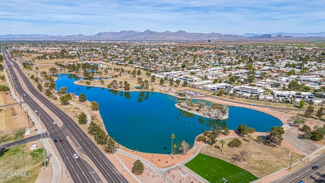 aerial view featuring a water and mountain view