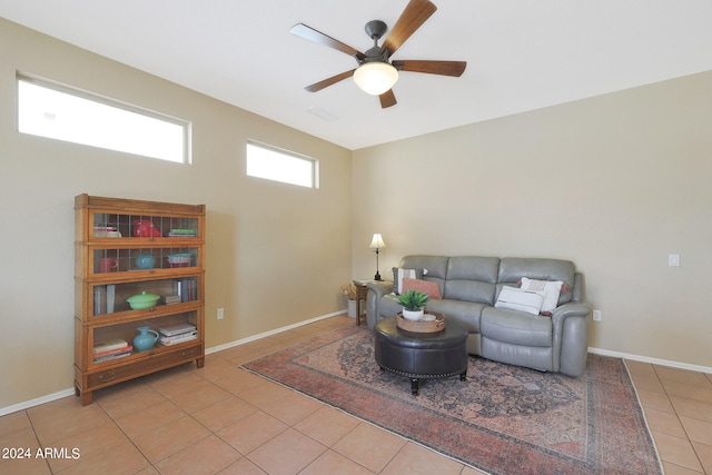 tiled living room with ceiling fan