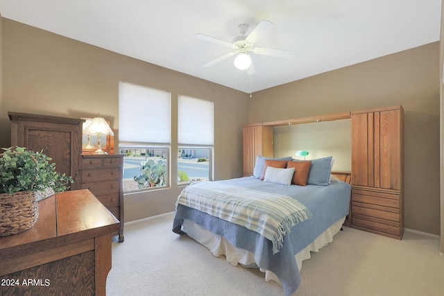 carpeted bedroom with ceiling fan