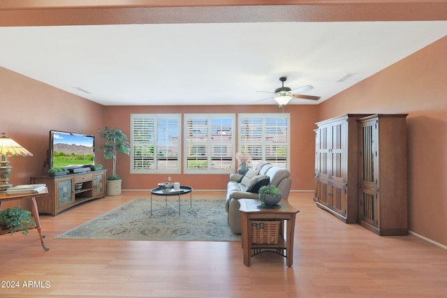 living room with ceiling fan and light hardwood / wood-style flooring