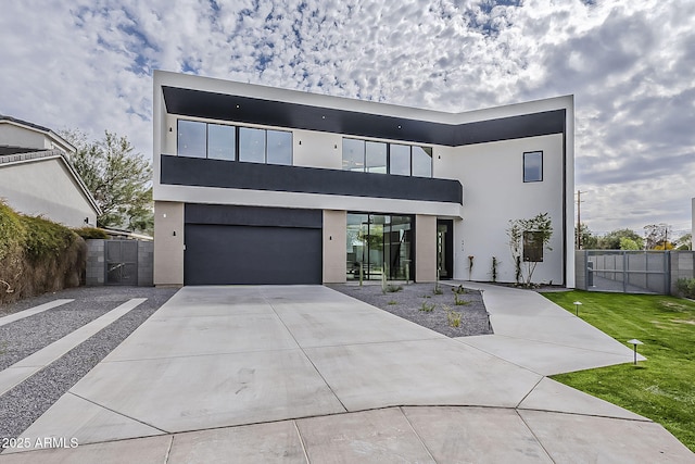 4414 N 29th St, Phoenix, AZ 85016 - contemporary house with stucco siding, a garage, concrete driveway, and a gate