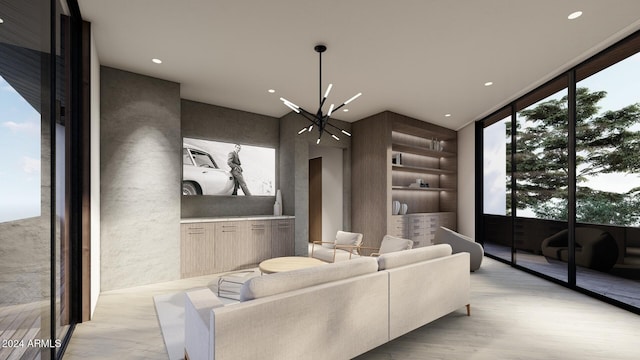 home theater room with light hardwood / wood-style floors and an inviting chandelier