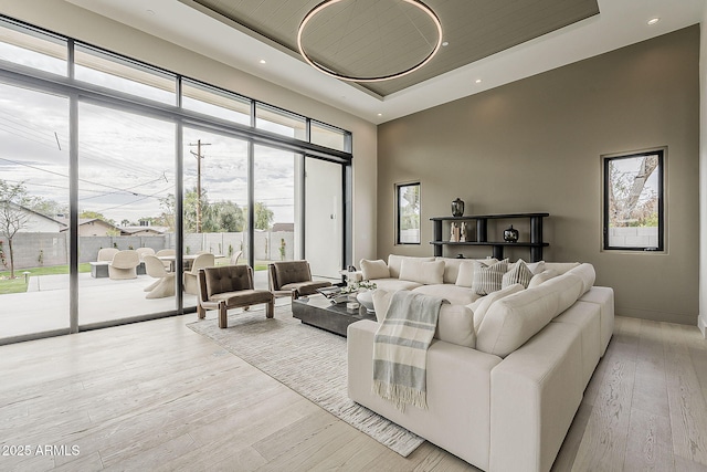 4414 N 29th St, Phoenix, AZ 85016 - living room with a raised ceiling, a towering ceiling, wood finished floors, and recessed lighting