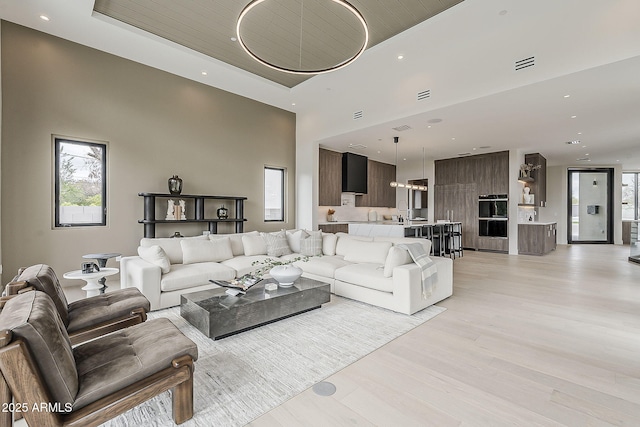 4414 N 29th St, Phoenix, AZ 85016 - living room with recessed lighting, light wood-type flooring, and a high ceiling