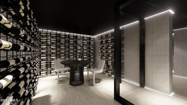 wine area with hardwood / wood-style flooring