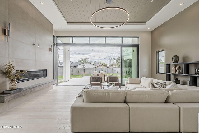 4414 N 29th St, Phoenix, AZ 85016 - living room featuring a tray ceiling, wood finished floors, and recessed lighting