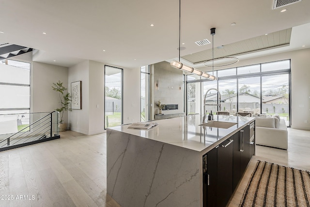 4414 N 29th St, Phoenix, AZ 85016 - kitchen featuring a sink, plenty of natural light, light wood-style flooring, open floor plan, and recessed lighting