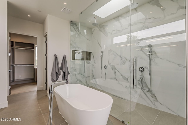 4414 N 29th St, Phoenix, AZ 85016 - full bath with a marble finish shower, a soaking tub, a skylight, recessed lighting, and a walk in closet