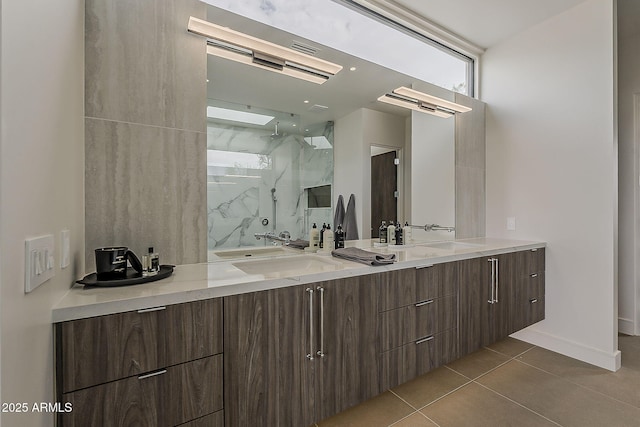 4414 N 29th St, Phoenix, AZ 85016 - bathroom featuring double vanity, a marble finish shower, tile patterned flooring, and baseboards