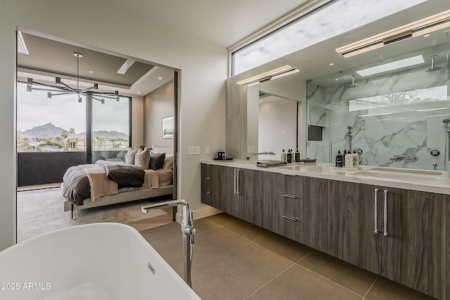 4414 N 29th St, Phoenix, AZ 85016 - ensuite bathroom featuring plenty of natural light, a soaking tub, double vanity, tile patterned flooring, and recessed lighting