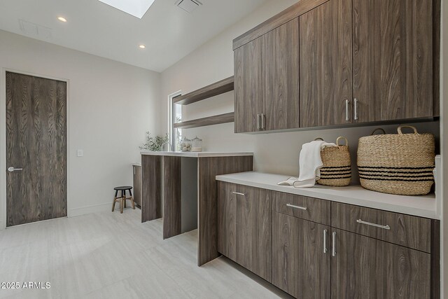 4414 N 29th St, Phoenix, AZ 85016 - laundry room with recessed lighting, a skylight, and baseboards