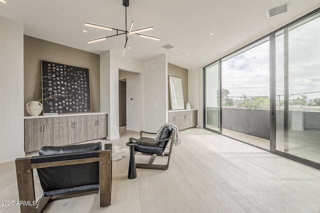 4414 N 29th St, Phoenix, AZ 85016 - living area featuring light wood finished floors and recessed lighting