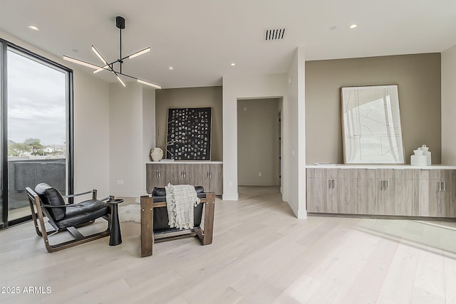 4414 N 29th St, Phoenix, AZ 85016 - sitting room featuring a chandelier, light wood-style flooring, recessed lighting, and baseboards