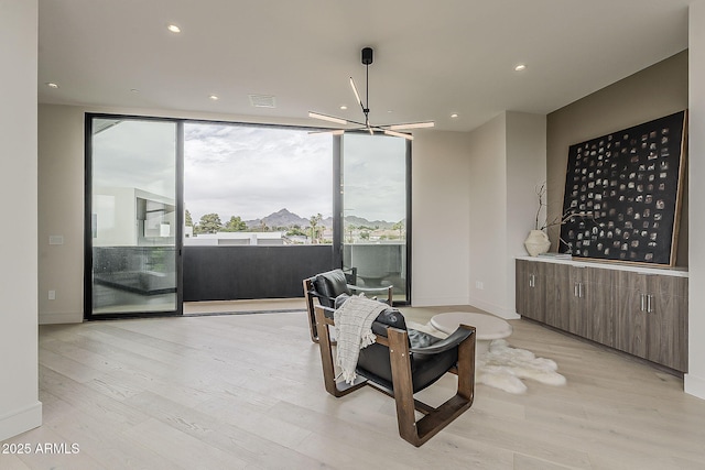 4414 N 29th St, Phoenix, AZ 85016 - sitting room with light wood-style flooring, recessed lighting, and baseboards