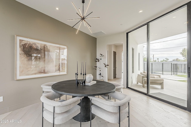 4414 N 29th St, Phoenix, AZ 85016 - dining space featuring a chandelier, light wood finished floors, and recessed lighting