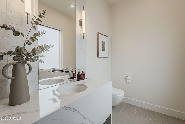 4414 N 29th St, Phoenix, AZ 85016 - bathroom with vanity, toilet, baseboards, and tile patterned floors