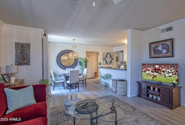 19777 N 76th St Unit 2142, Scottsdale, AZ 85255 - living room with a chandelier, wood finished floors, and crown molding