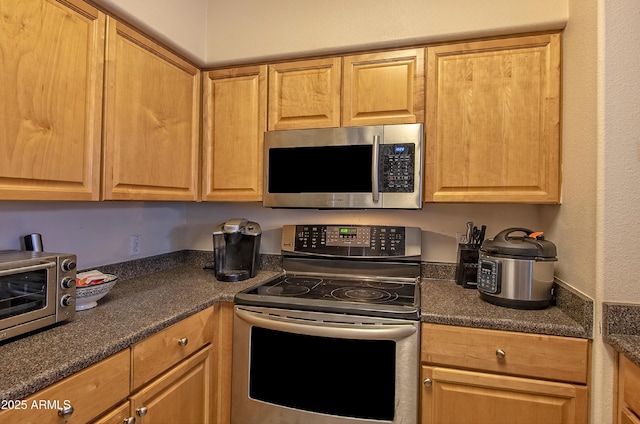 19777 N 76th St Unit 2142, Scottsdale, AZ 85255 - kitchen with appliances with stainless steel finishes and dark countertops